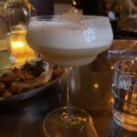 Sidecar Cocktail with a foam top, served in a Coup glass